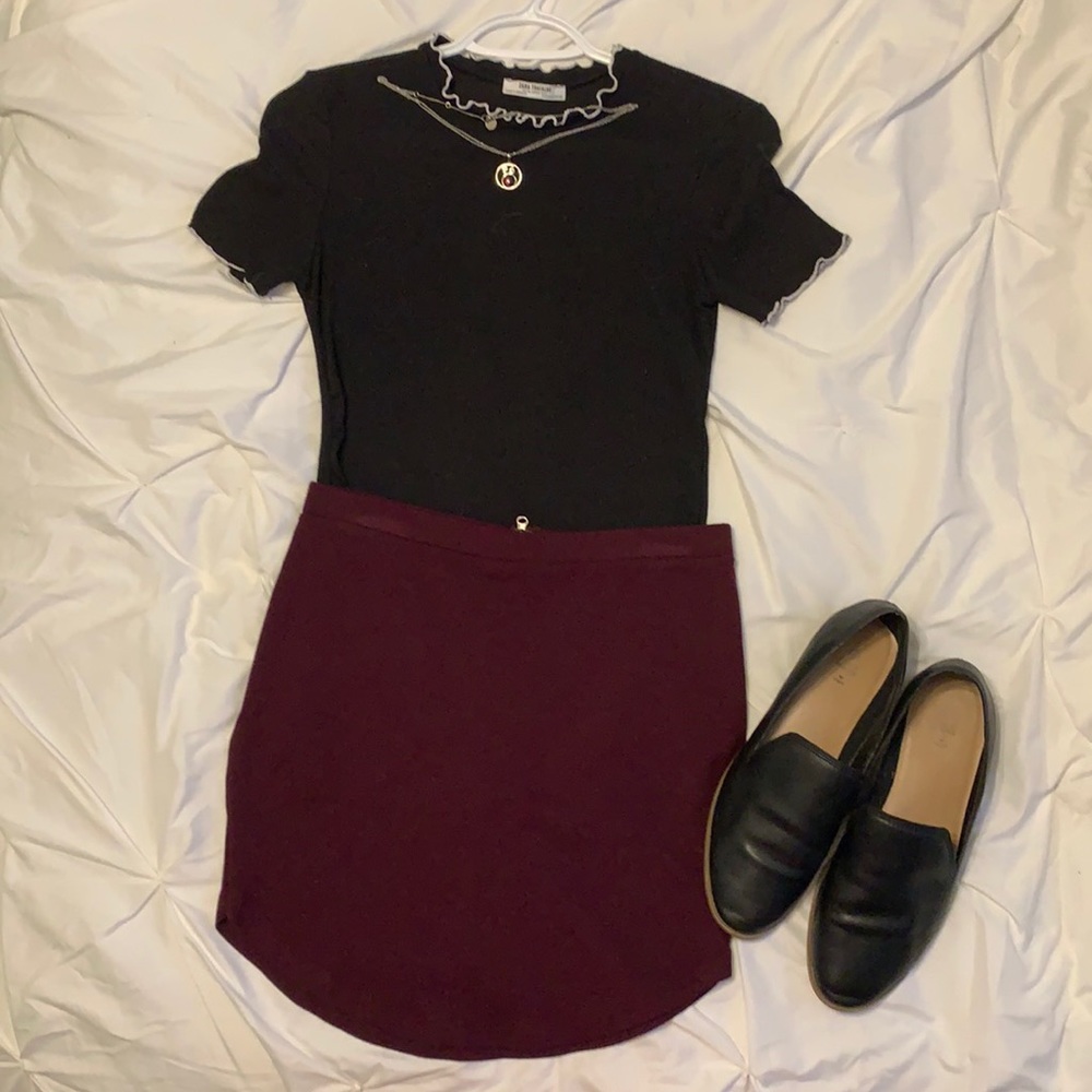 Burgundy skirt.